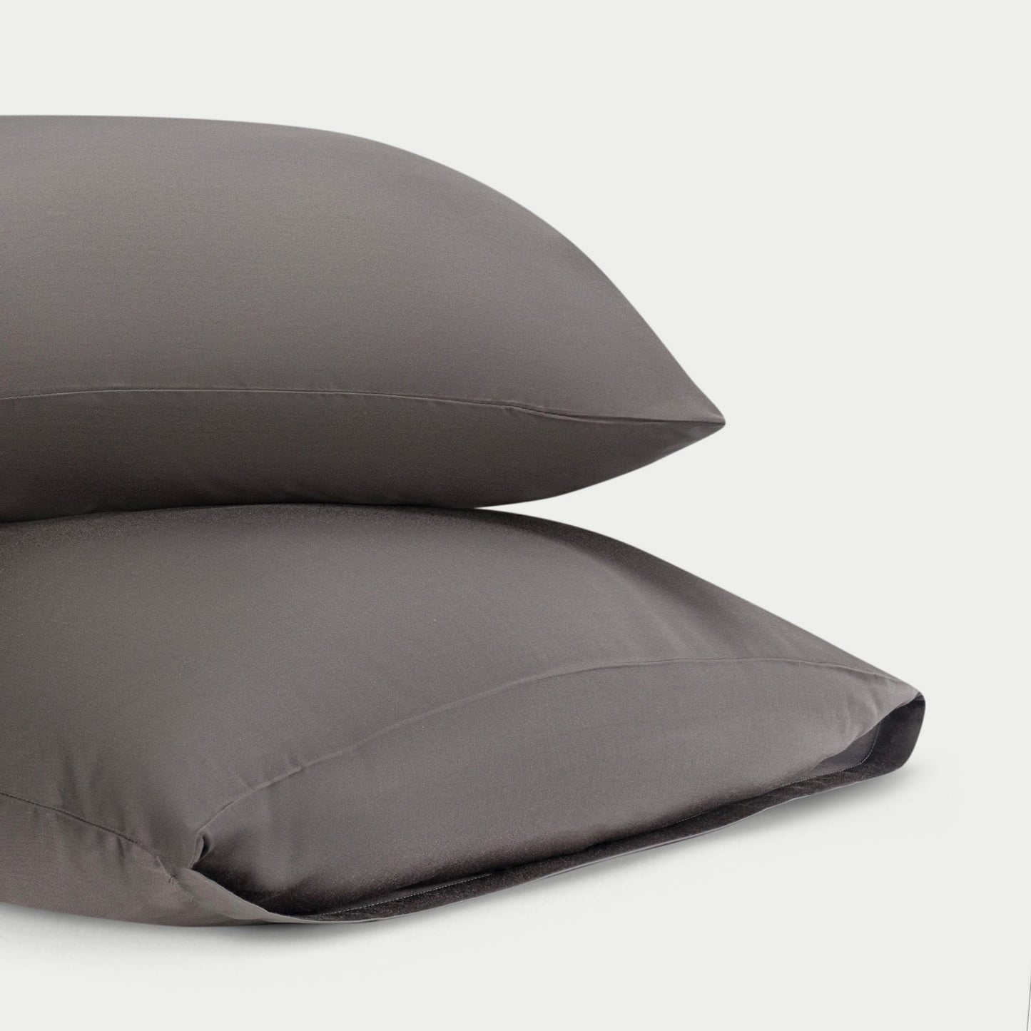 Two standard/king charcoal pillowcases with plain background
