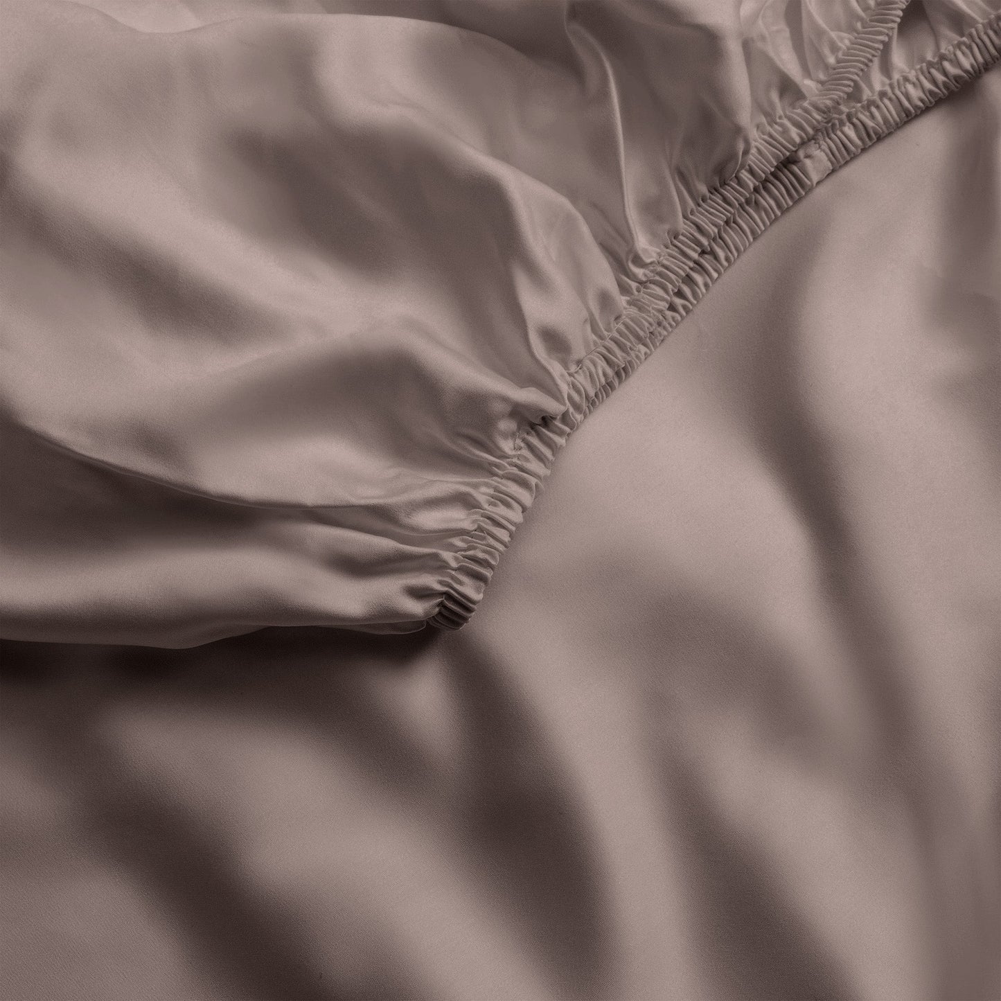Close up of stone fitted crib sheet |Color:Stone