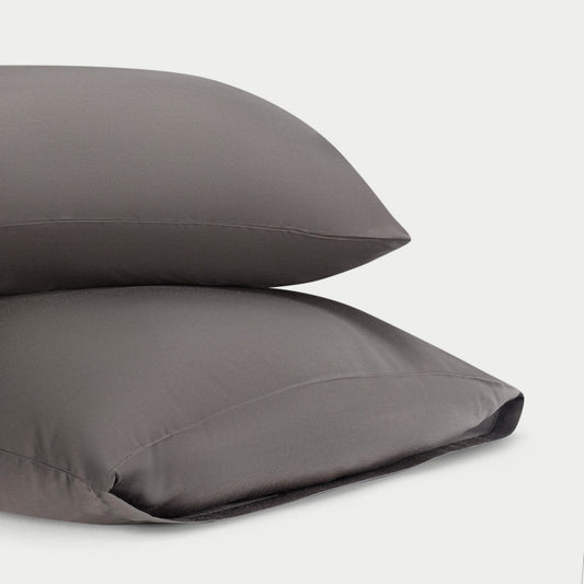 Two standard/king charcoal pillowcases with plain background