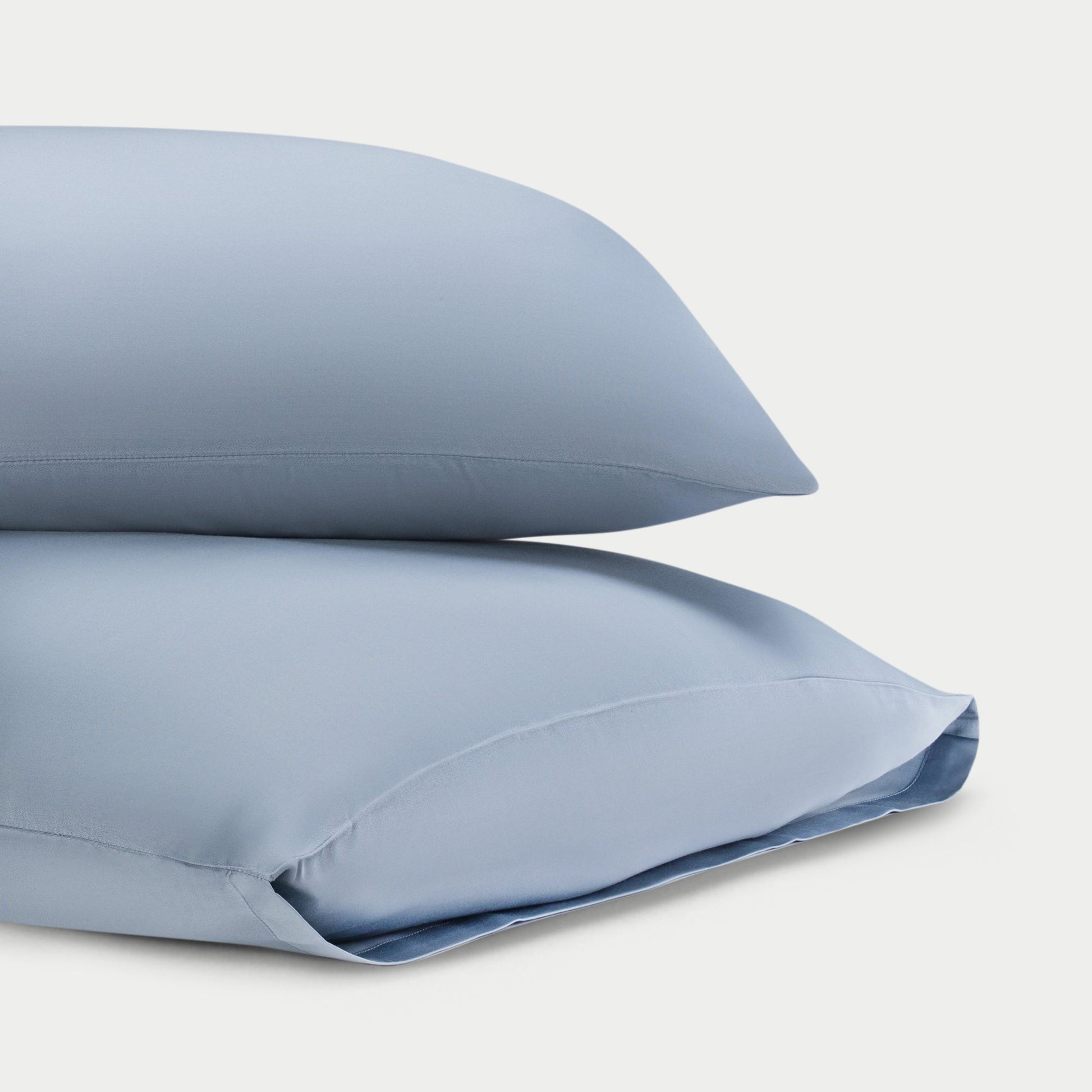 Two harbor mist pillowcases with a plain background standard/king/body