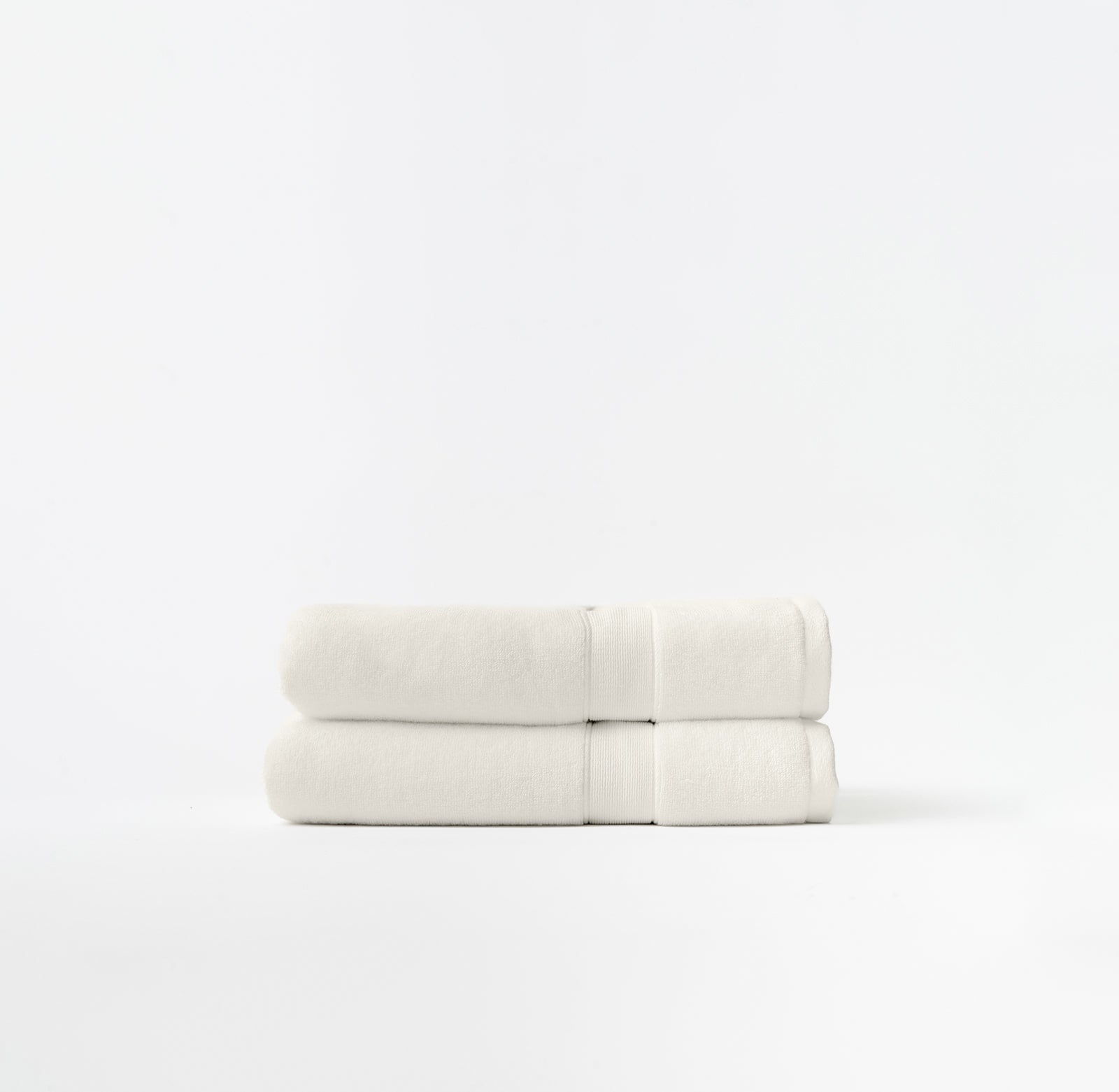 Seashell luxe bath towels folded with white background |Color:Seashell