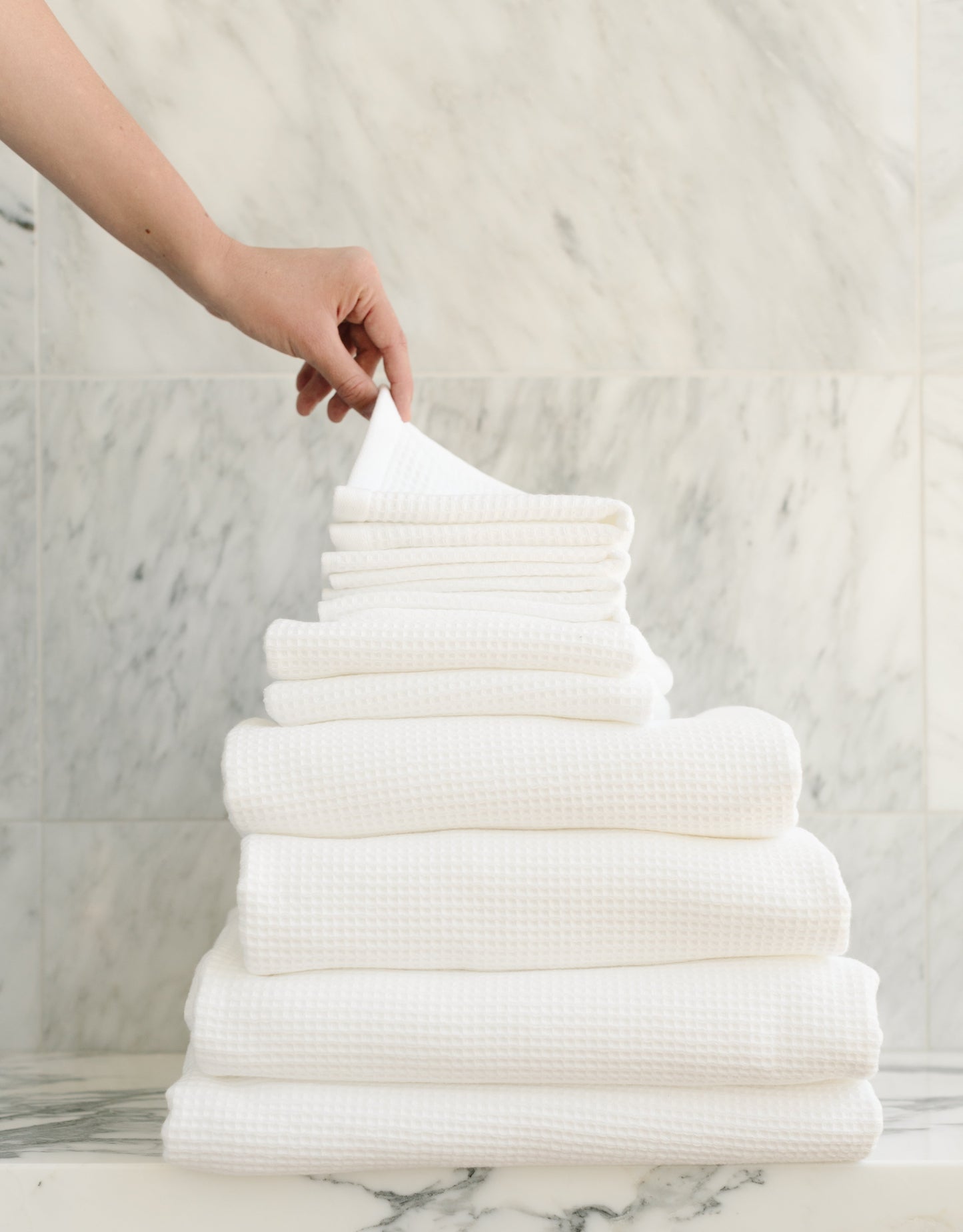 Complete Waffle Bath Bundle in the color White. Photo of White Complete Waffle Bath Bundle taken resting on a marble counter top. |Color:White